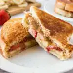 Grilled peanut butter sandwich on a plate.