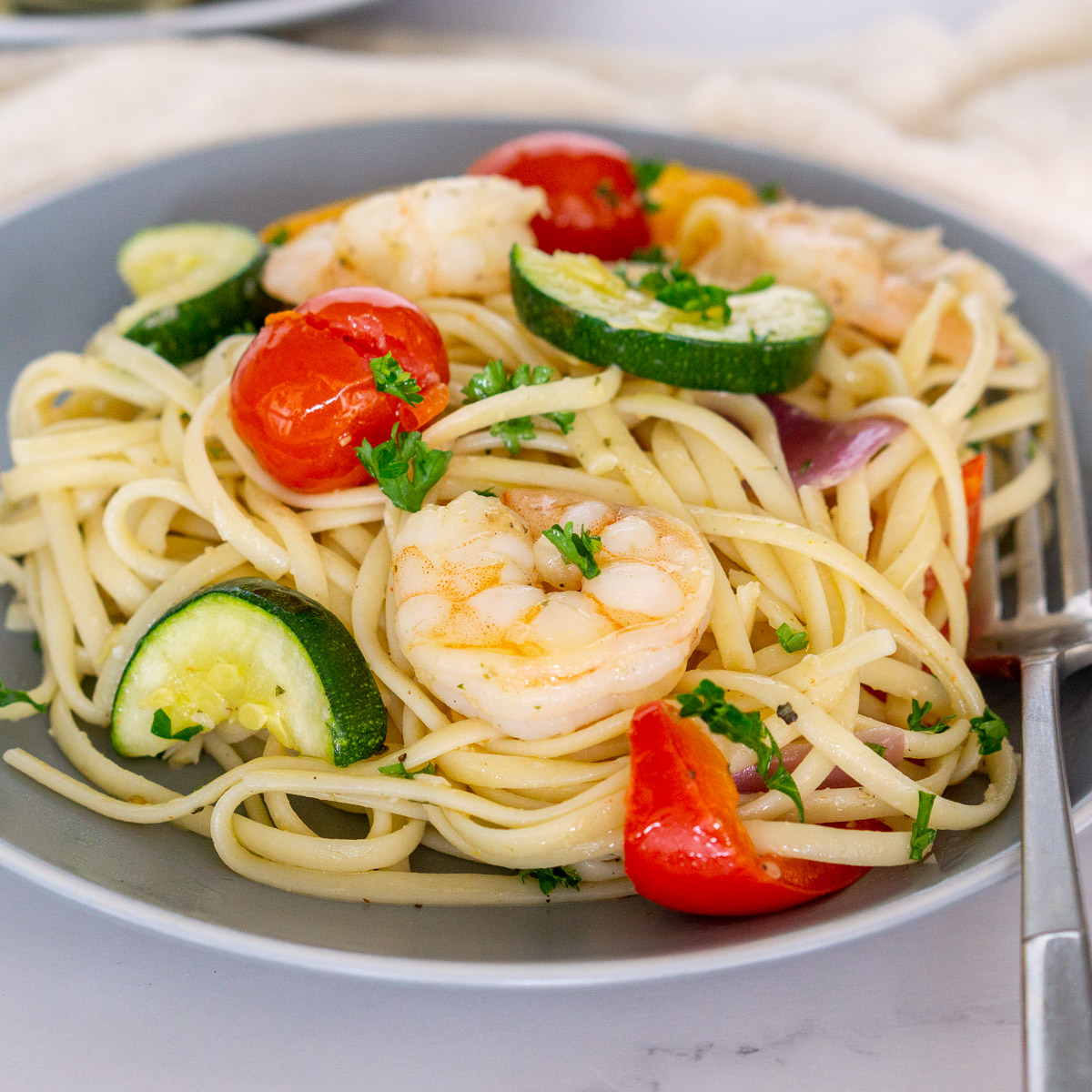shrimp and vegetable linguine on a plate