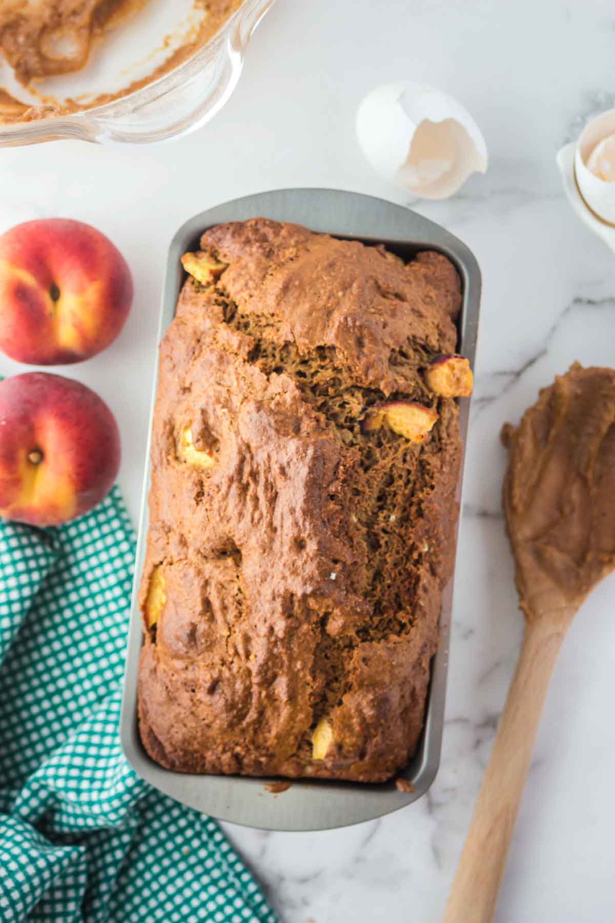 Loaf of peach bread in a pan.