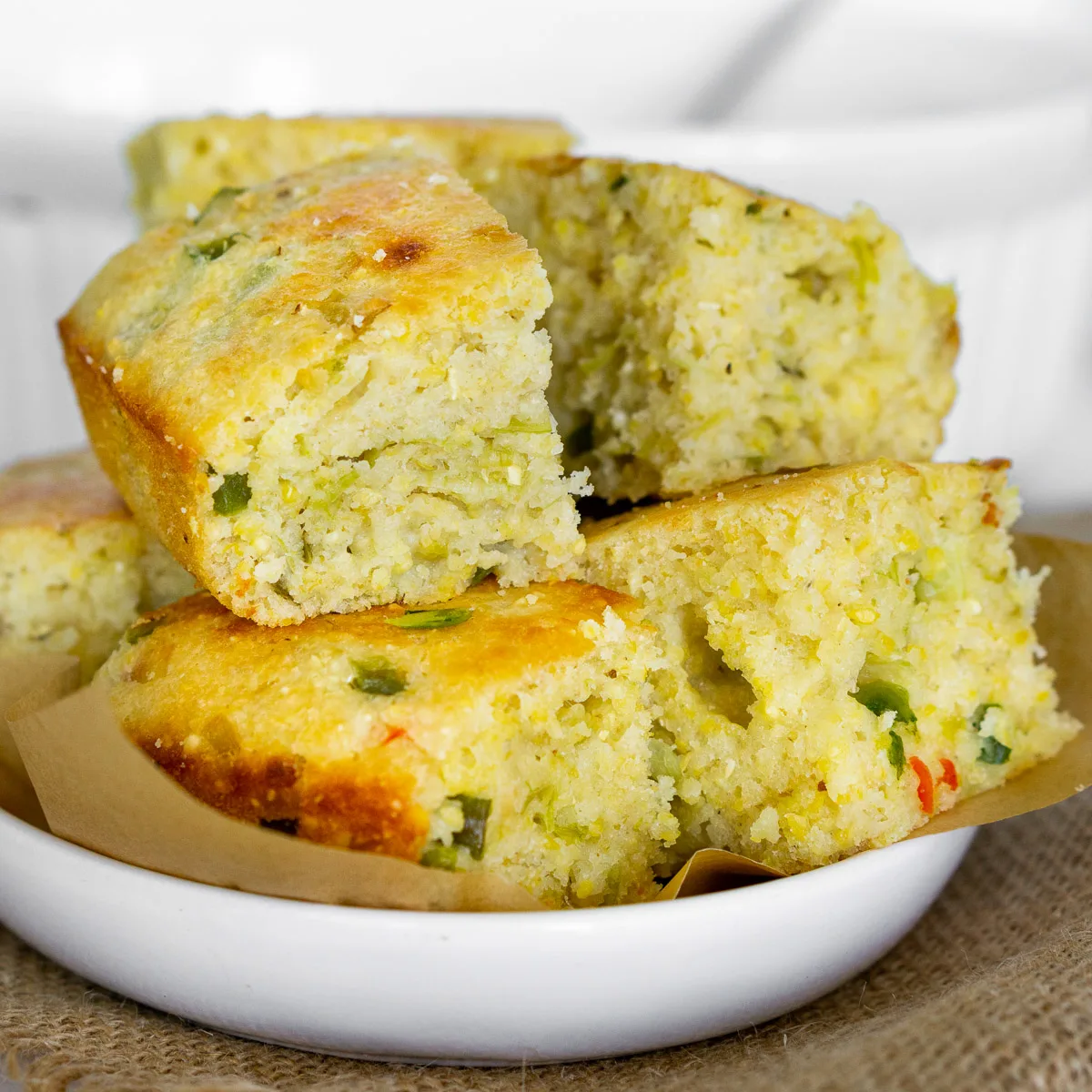 stack of savory cornbread pieces on a plate