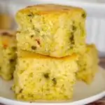 stack of savory cornbread pieces on a plate
