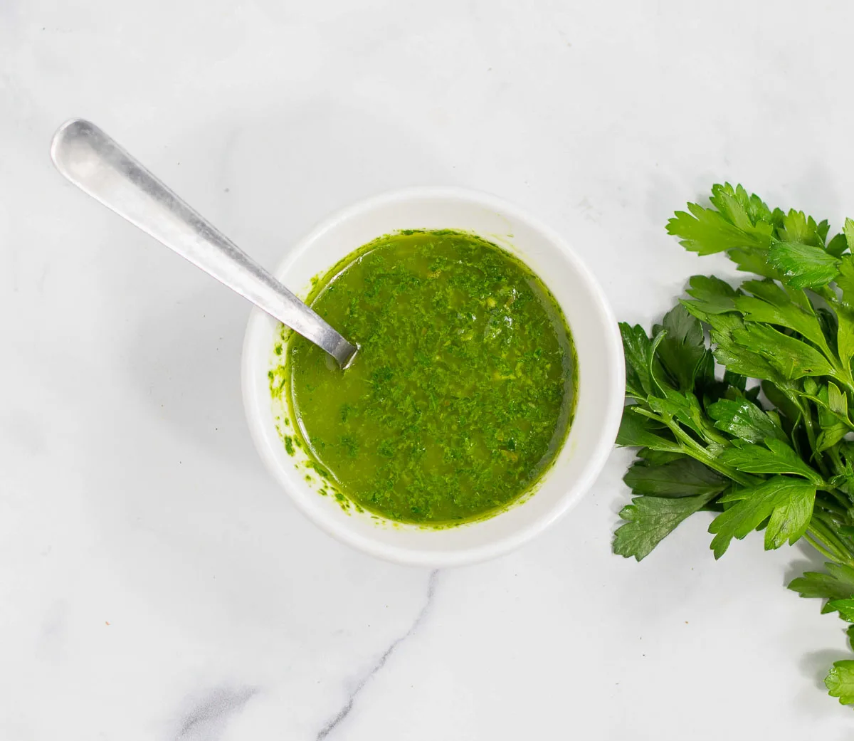 Parsley salsa verde in a small bowl.