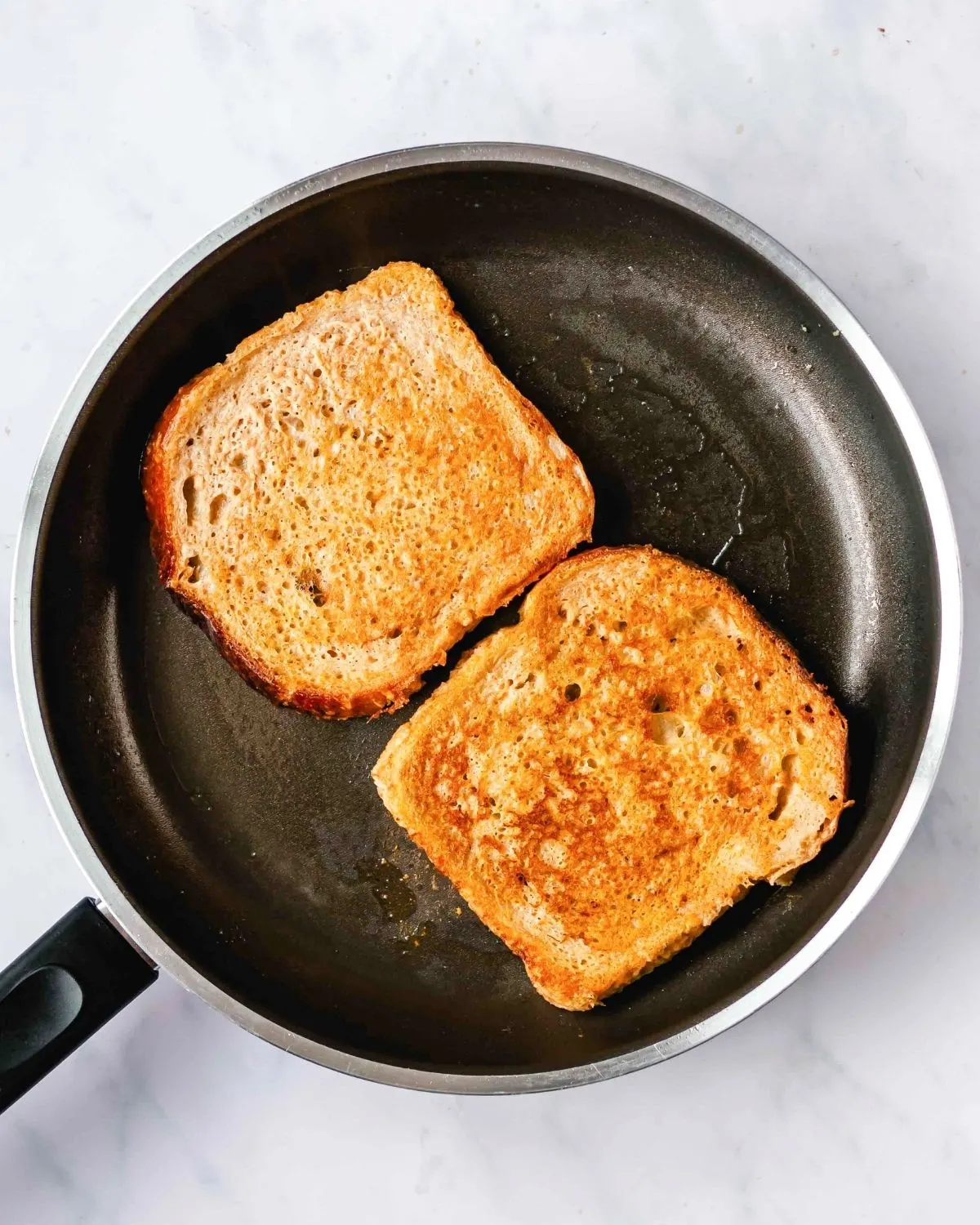 cooking pumpkin french toast in a skillet
