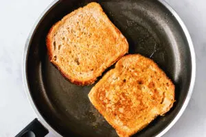 pumpkin french toast frying in a skillet