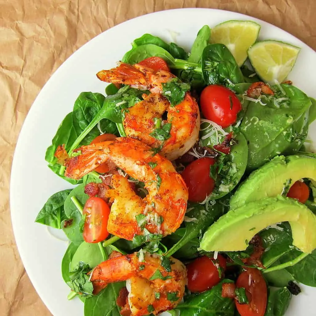 Close up of Cajun shrimp on salad