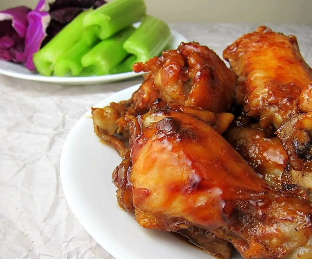 honey garlic wings with veggies in the background