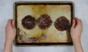 image of venison burger patties on a baking dish