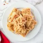 Stack of peanut butter rice krispies treats on a plate.