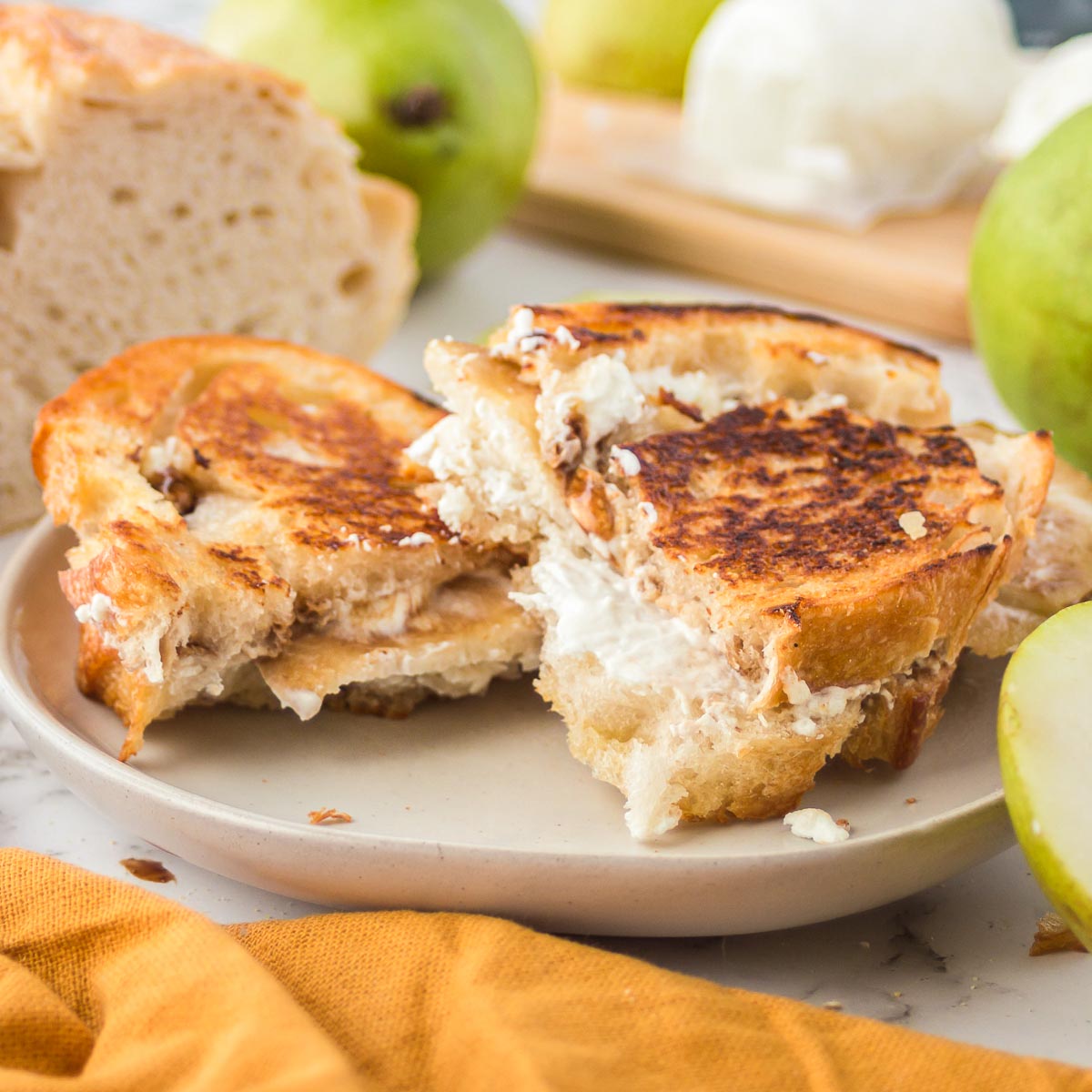 Pear and goat cheese grilled cheese sandwich on a plate.