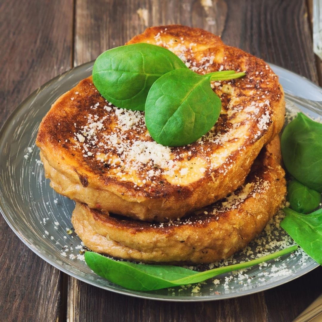 savory french toast on a plate with basil