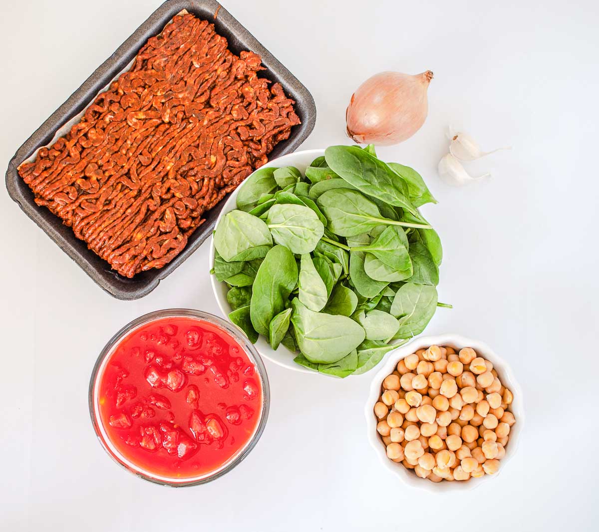 Ingredients to make chickpea chorizo stew with tomatoes.