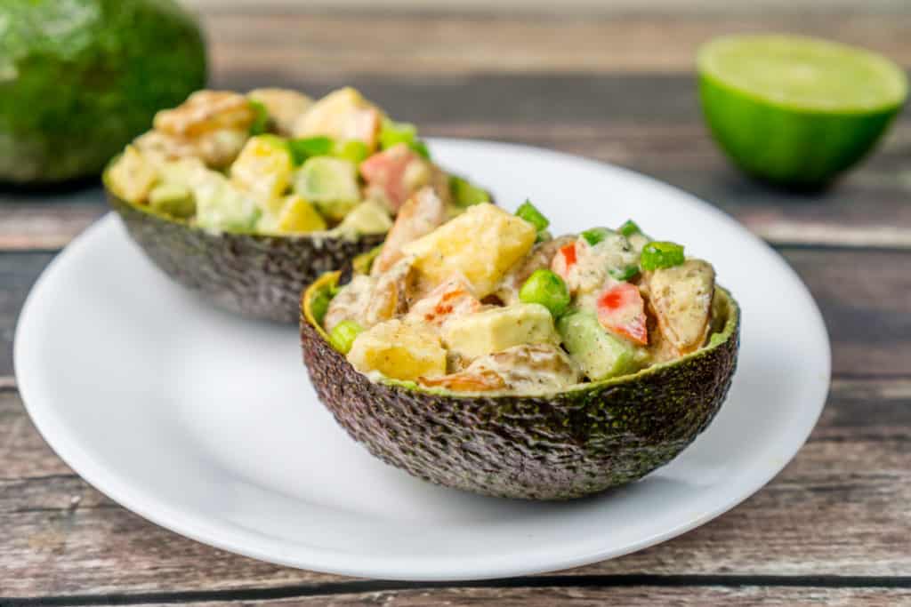 Avocado boats stuffed with tropical shrimp salad