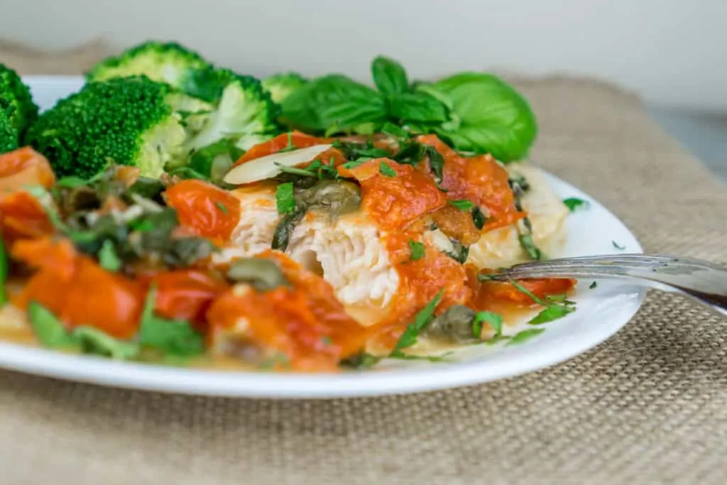 A truly wonderful dinner ready in 20 minutes! Tender flaky Swai Fillets with Tomato Caper Sauce topped with fresh herbs is irresistible, easy to cook, and very healthy. This recipe is great way to use seasonal produce and herbs. From https://www.babaganosh.org