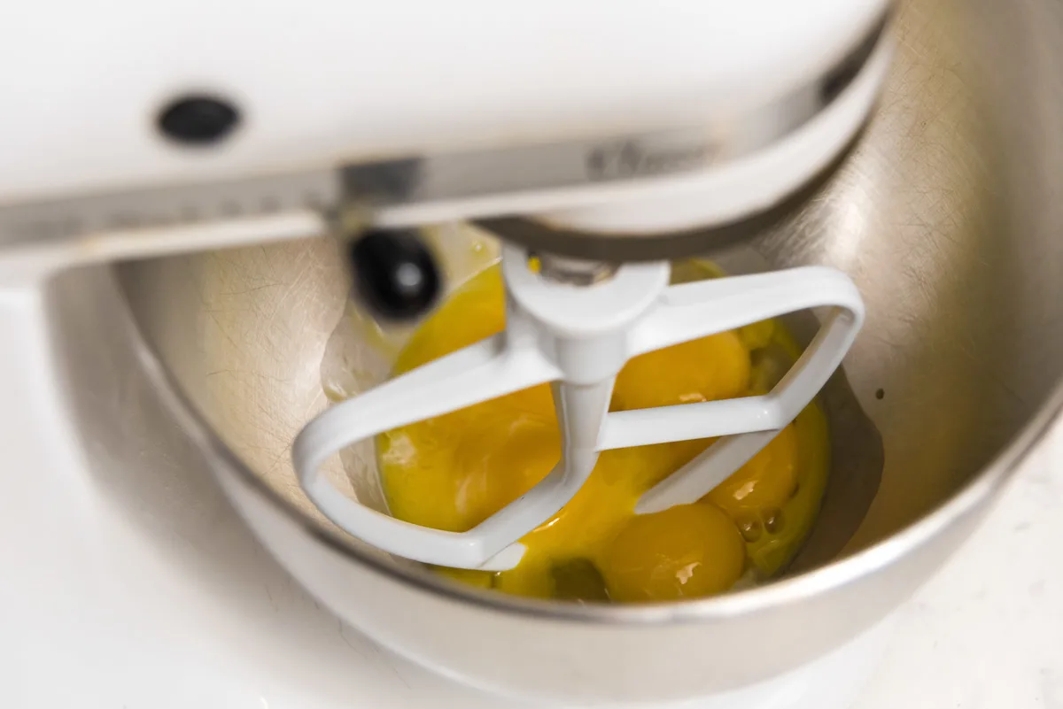 mixing egg yolks in a mixer