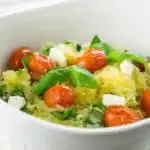 This Tomato Basil Spaghetti Squash recipe is super healthy, easy, and delicious. A great side dish to complement any main course!