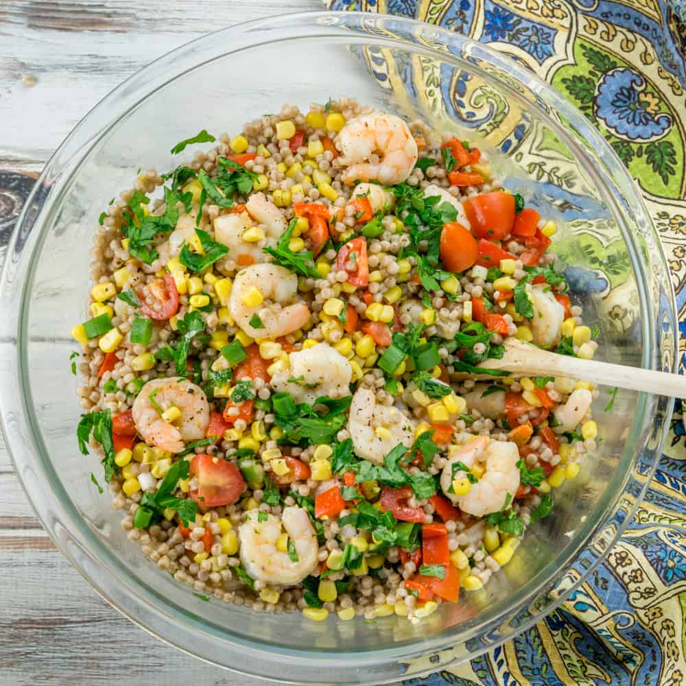 Bowl of shrimp couscous salad with vegetables