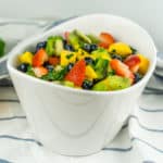 Enjoy this gorgeous Fruit Salad with Honey Lime Dressing as a healthy snack or as dessert for your next cookout!