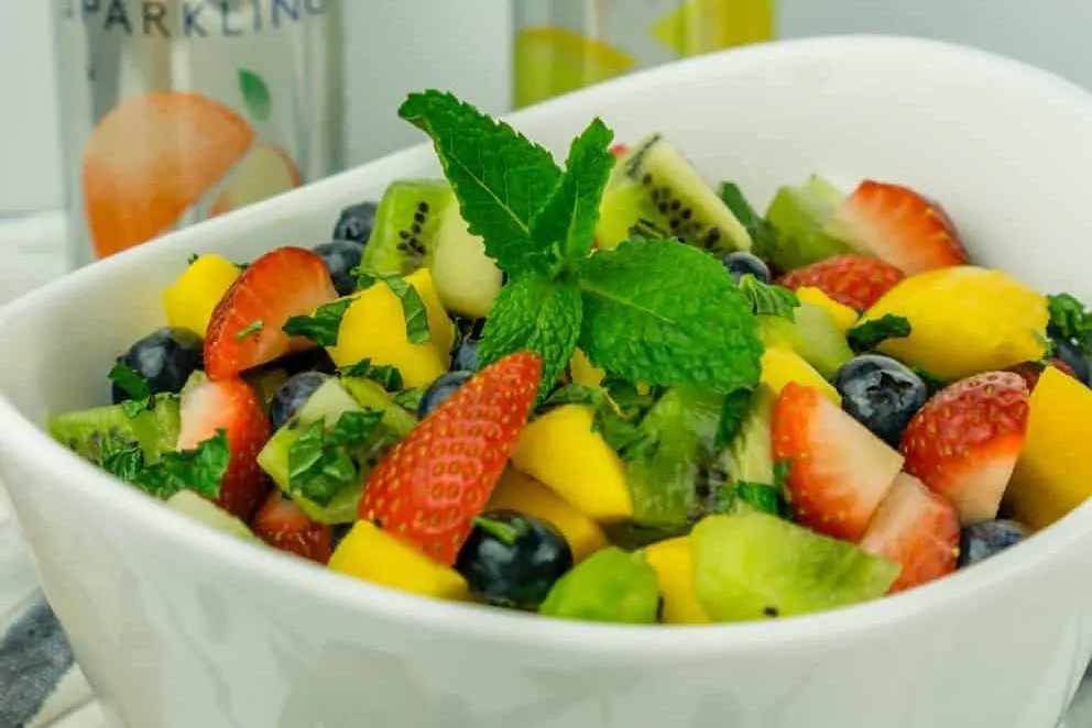 image of fruit salad with mint and honey lime dressing