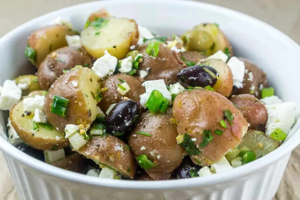 No Mayo Potato Salad with Feta and Olives in a bowl