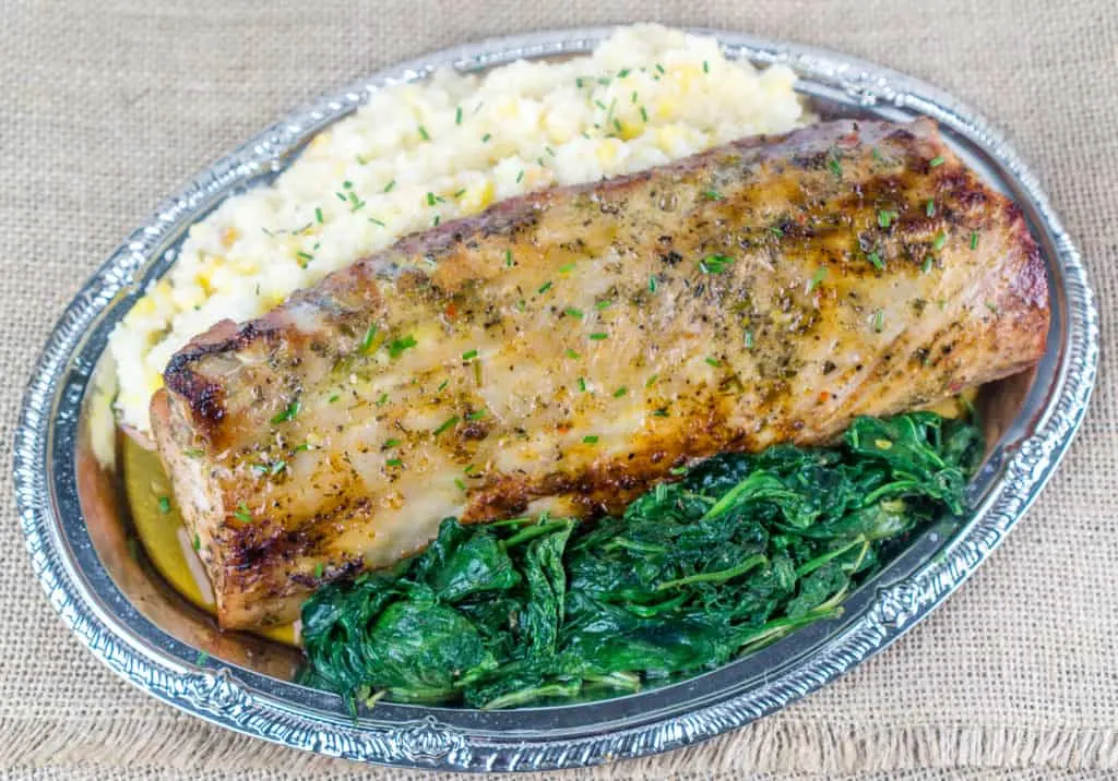 Roasted Pork Loin Dinner with Cheesy Grits and Sauteed Greens | Babaganosh.org