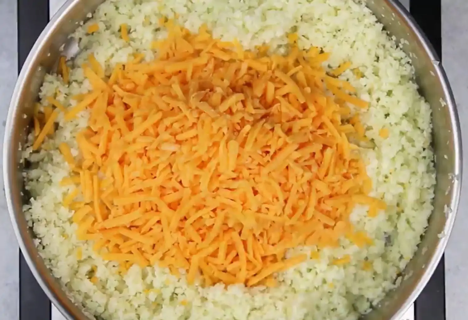 grated cauliflower with cheddar cheese