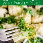 pinterest image of roasted cauliflower on a fork with parsley pesto