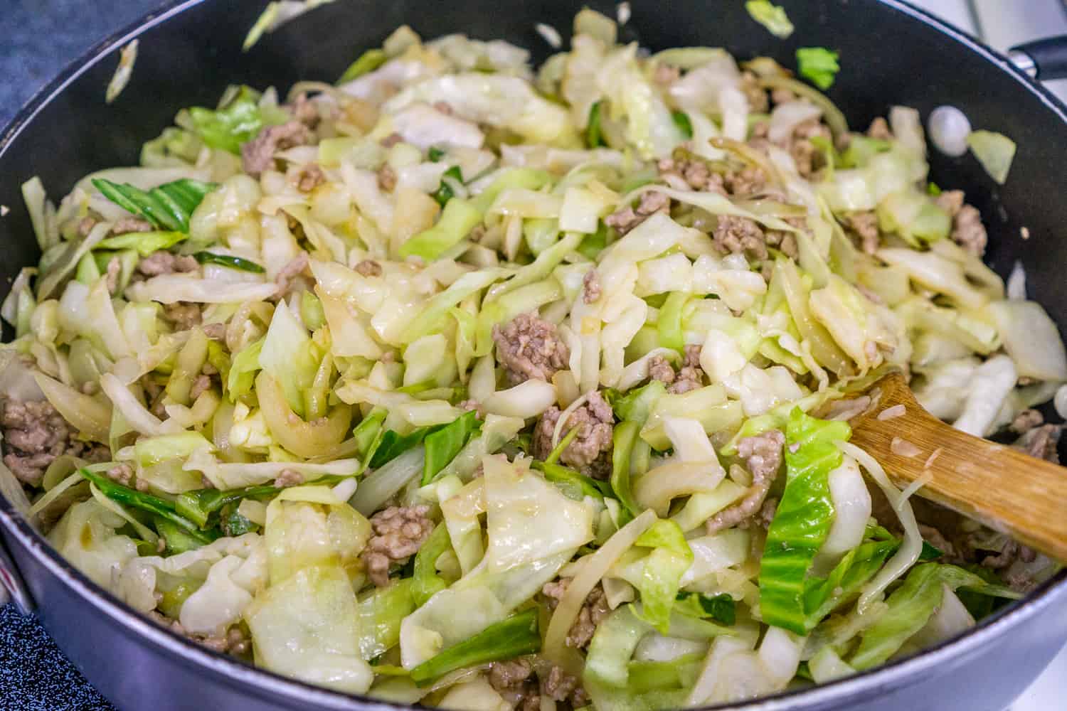 image of cabbage and pork in skillet