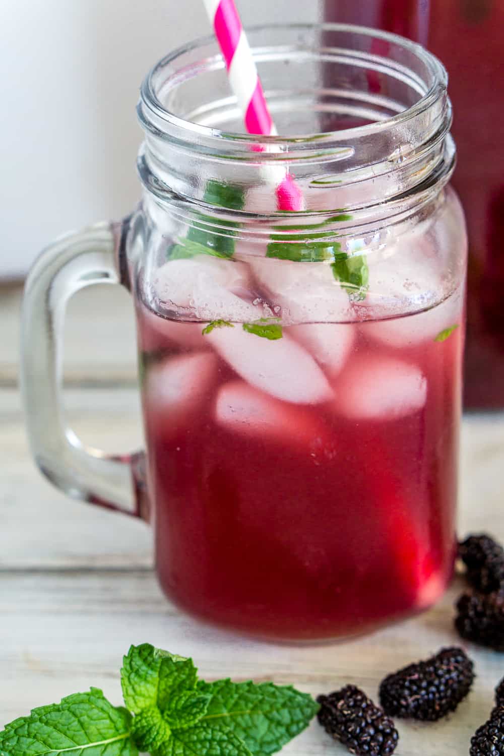 image of mulberry iced tea in a mason jar