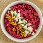 image of russian beet salad topped with feta cheese