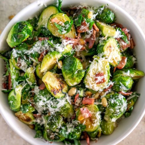 pan-fried brussels sprouts with parmesan and bacon in a bowl