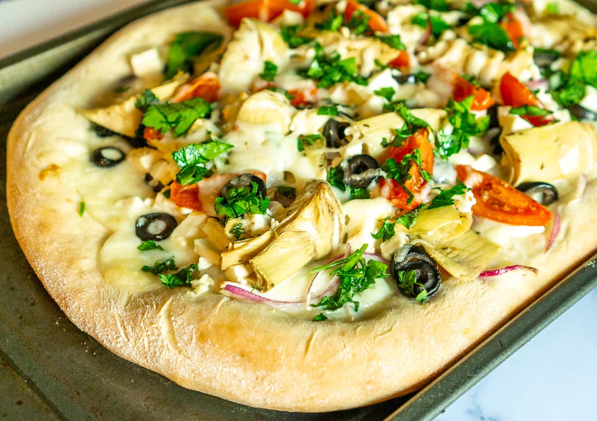 homemade pizza with greek toppings