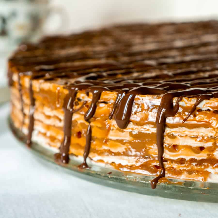 close up shot of Russian wafer cake with melted chocolate drizzle