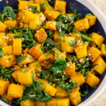 butternut squash and spinach on a plate