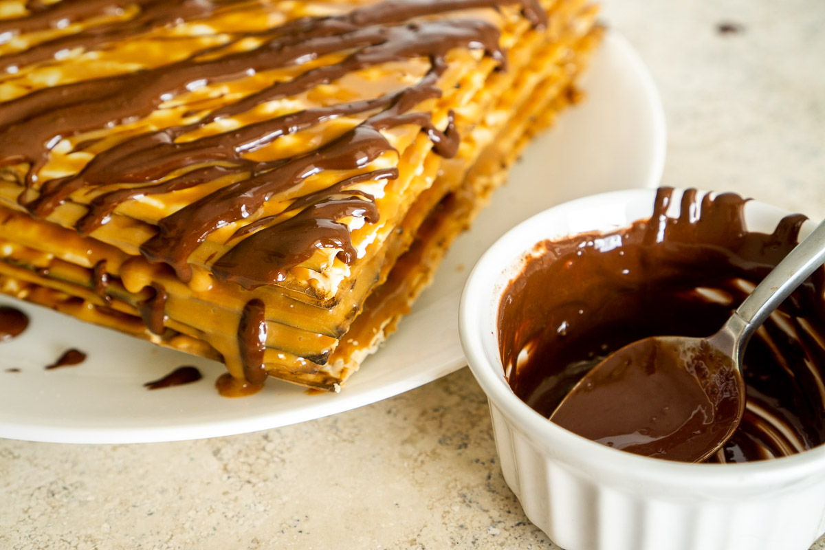 matzo with dulce de leche with chocolate drizzled on it