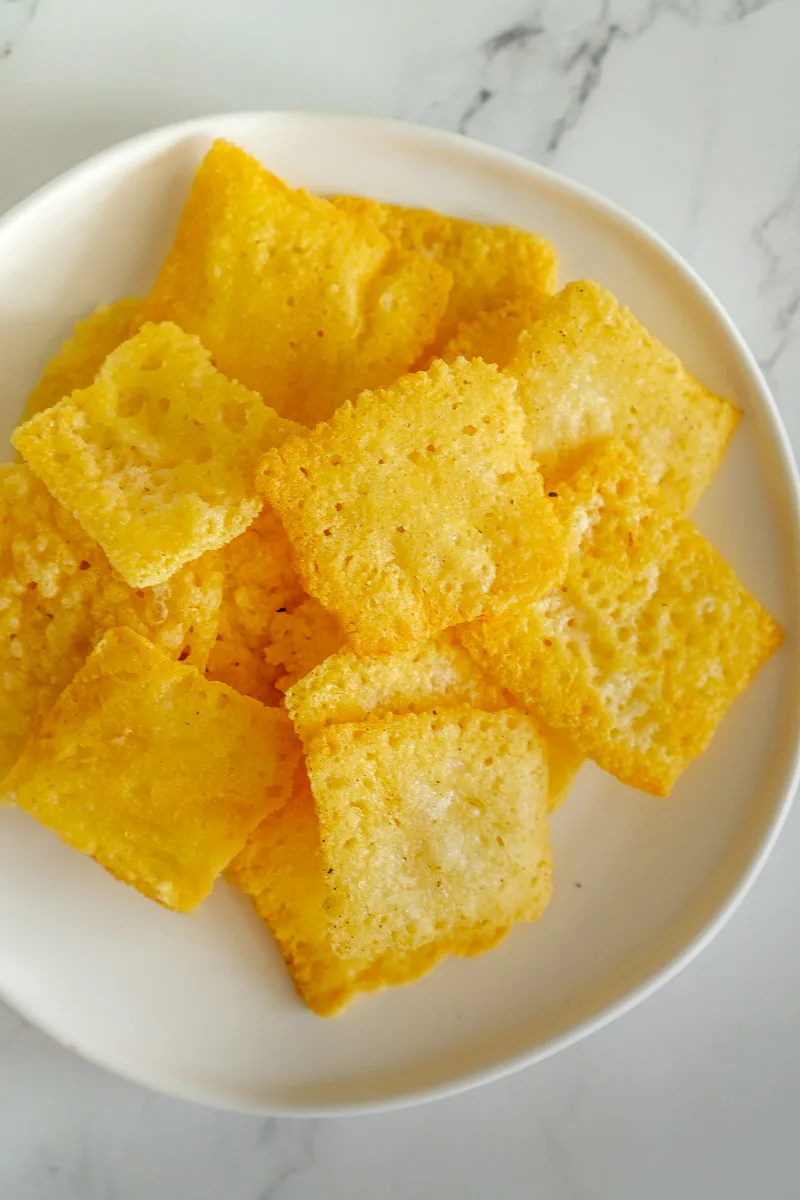 Keto asiago cheese crackers on a plate.