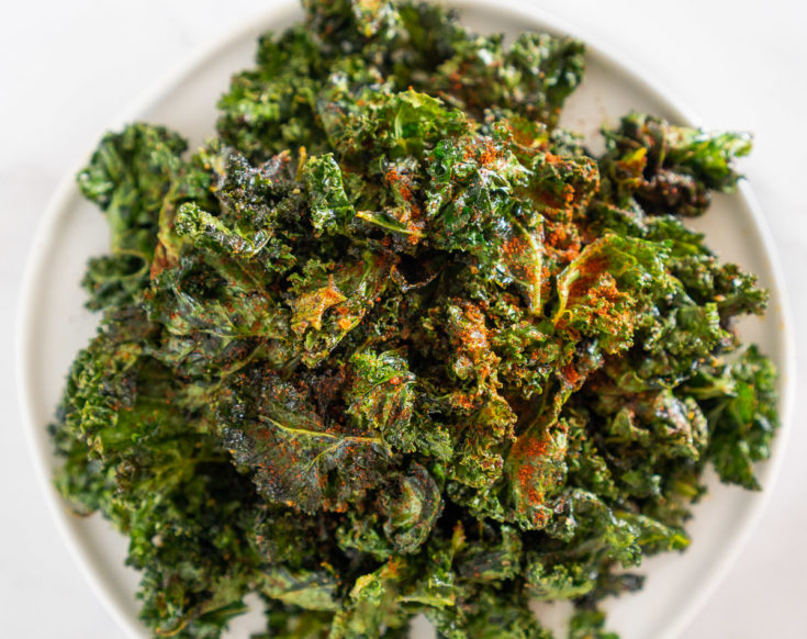 Cajun spiced kale chips on a plate.