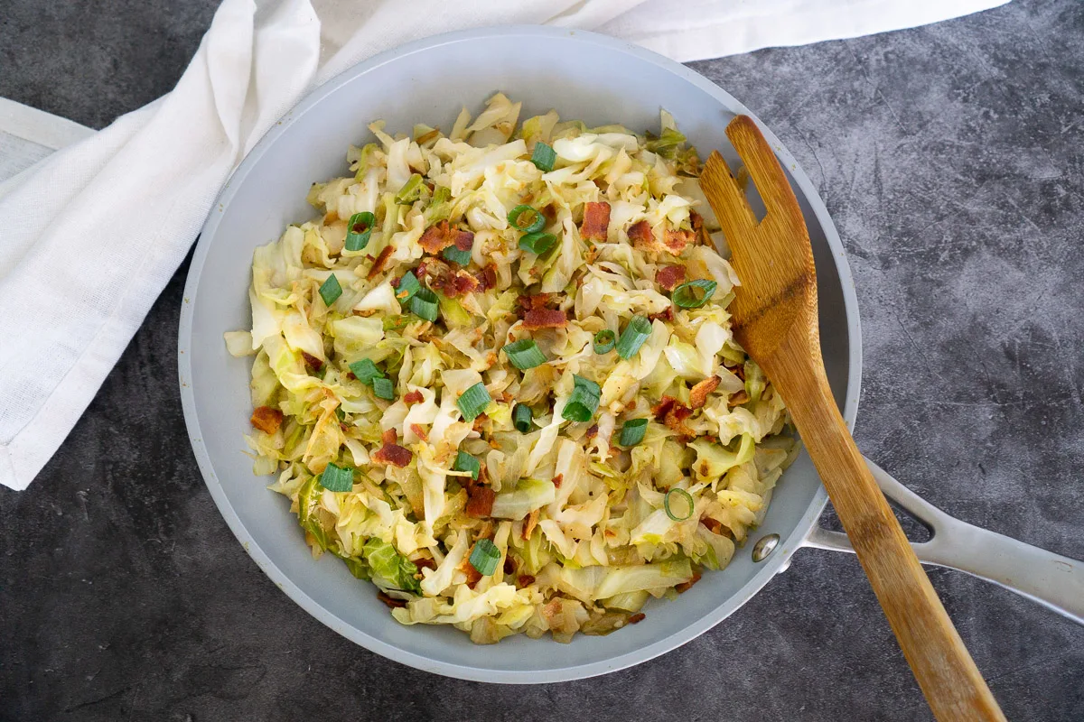 sauteed cabbage and bacon on a skillet