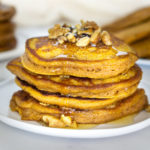 stack of pumpkin protein pancakes on a plate