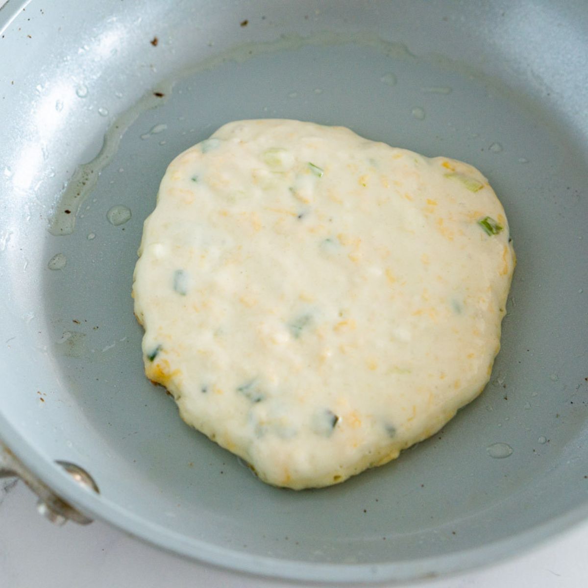 Cooking savory pancake in a pan