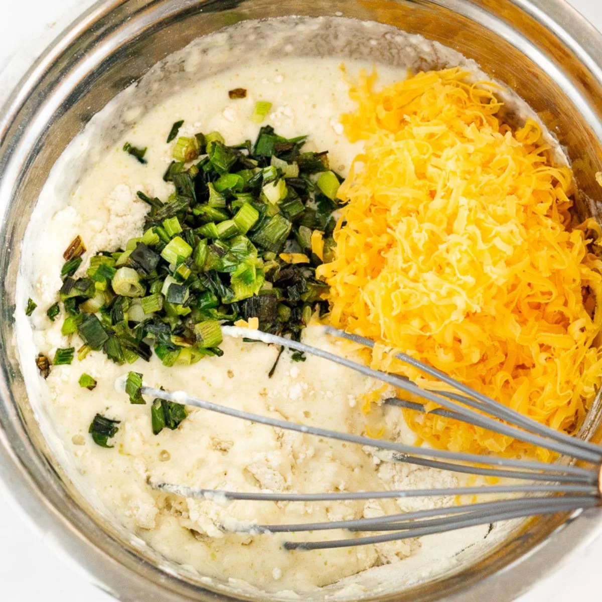 Adding shredded cheese and sauteed scallions to pancake batter