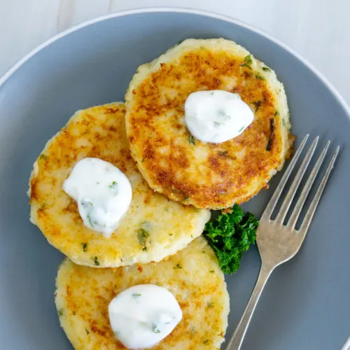 Mashed Potato Fritters with Garlicky Yogurt Sauce on a plate