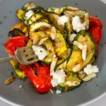 grilled zucchini salad on a plate with balsamic glaze