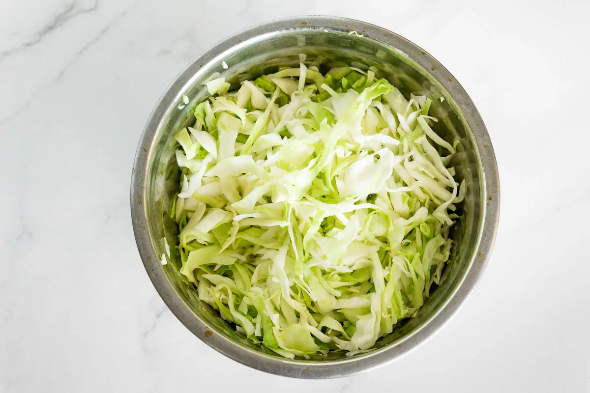 bowl of thinly sliced cabbage