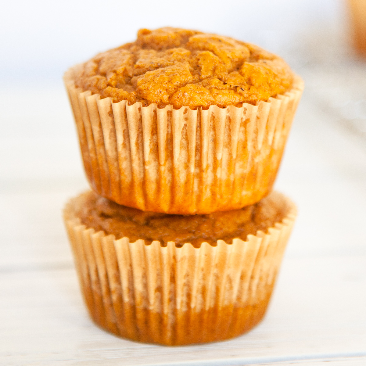 2 pumpkin spice muffins stacked on top of each other
