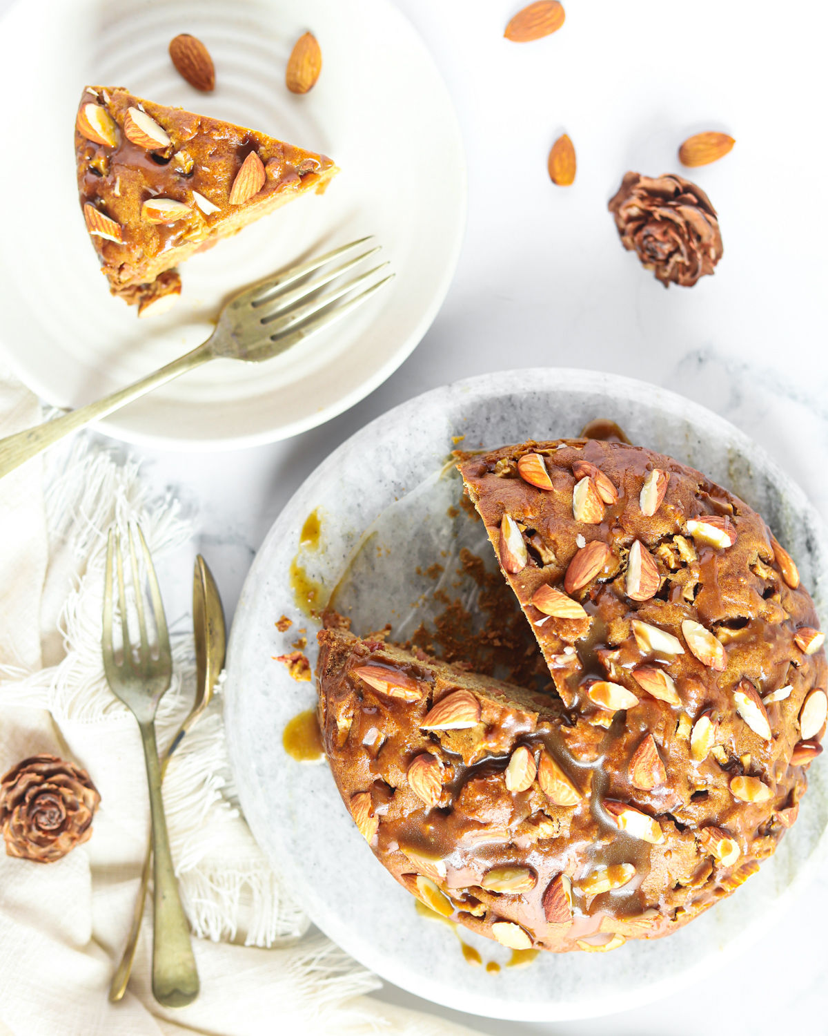 overhead shot of caramel apple cake topped with almonds