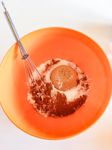 dry ingredients for cinnamon muffins in a bowl