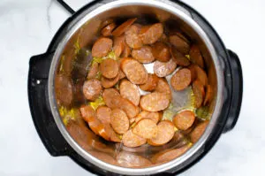 sliced Cajun sausage sauteing in an instant pot