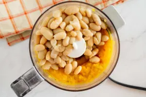 pureed butternut squash and cooked white beans in a food processor