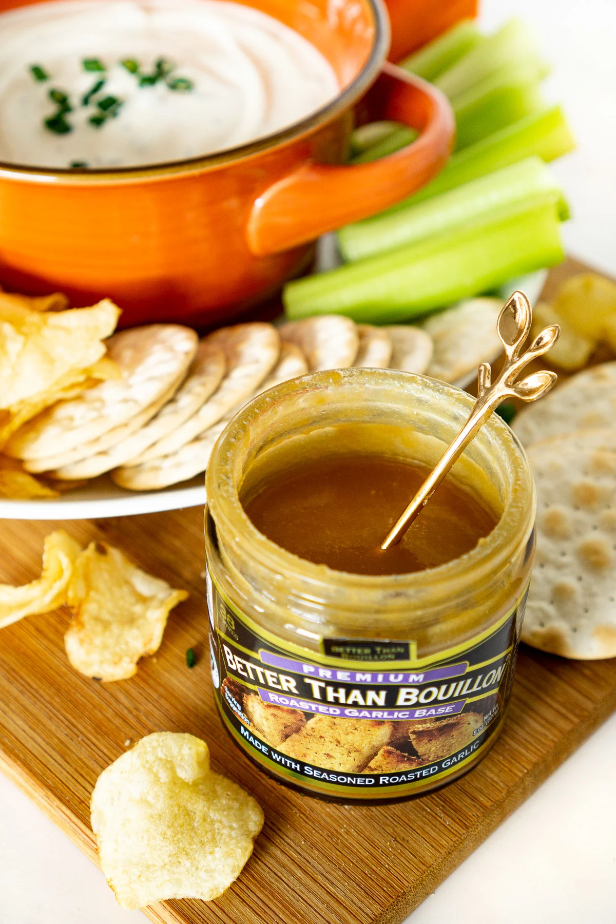 jar of better than bouillon roasted garlic base on an appetizer tray with a creamy garlic dip