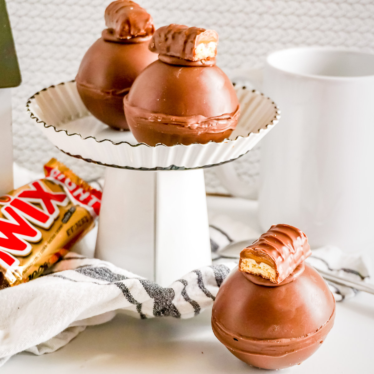 twix hot cocoa bombs on a display stand